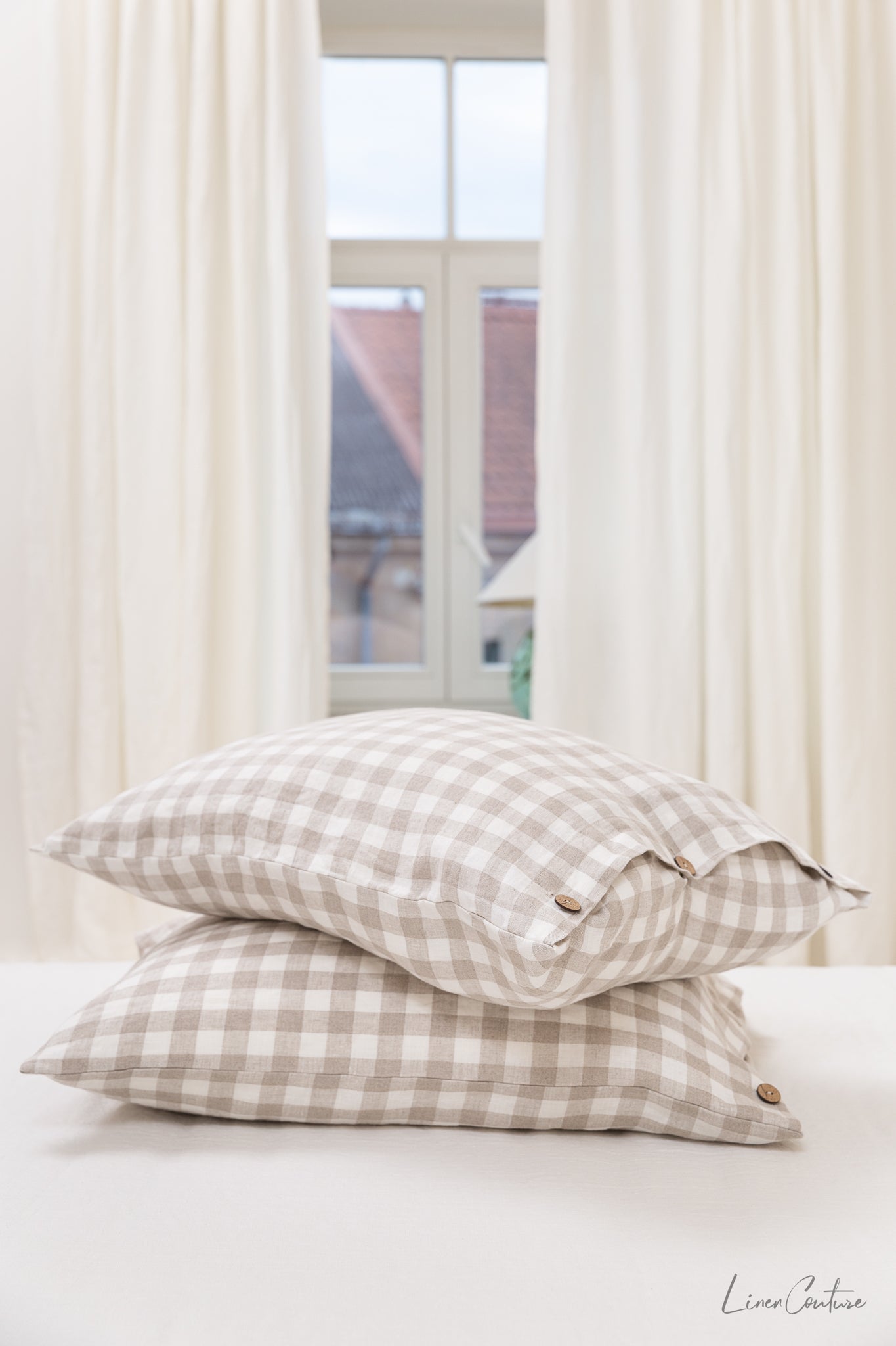White linen pillowcase with coconut buttons